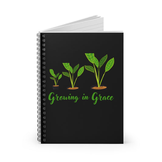 Black notebook with green plants and 'Growing in Grace' text on a white background