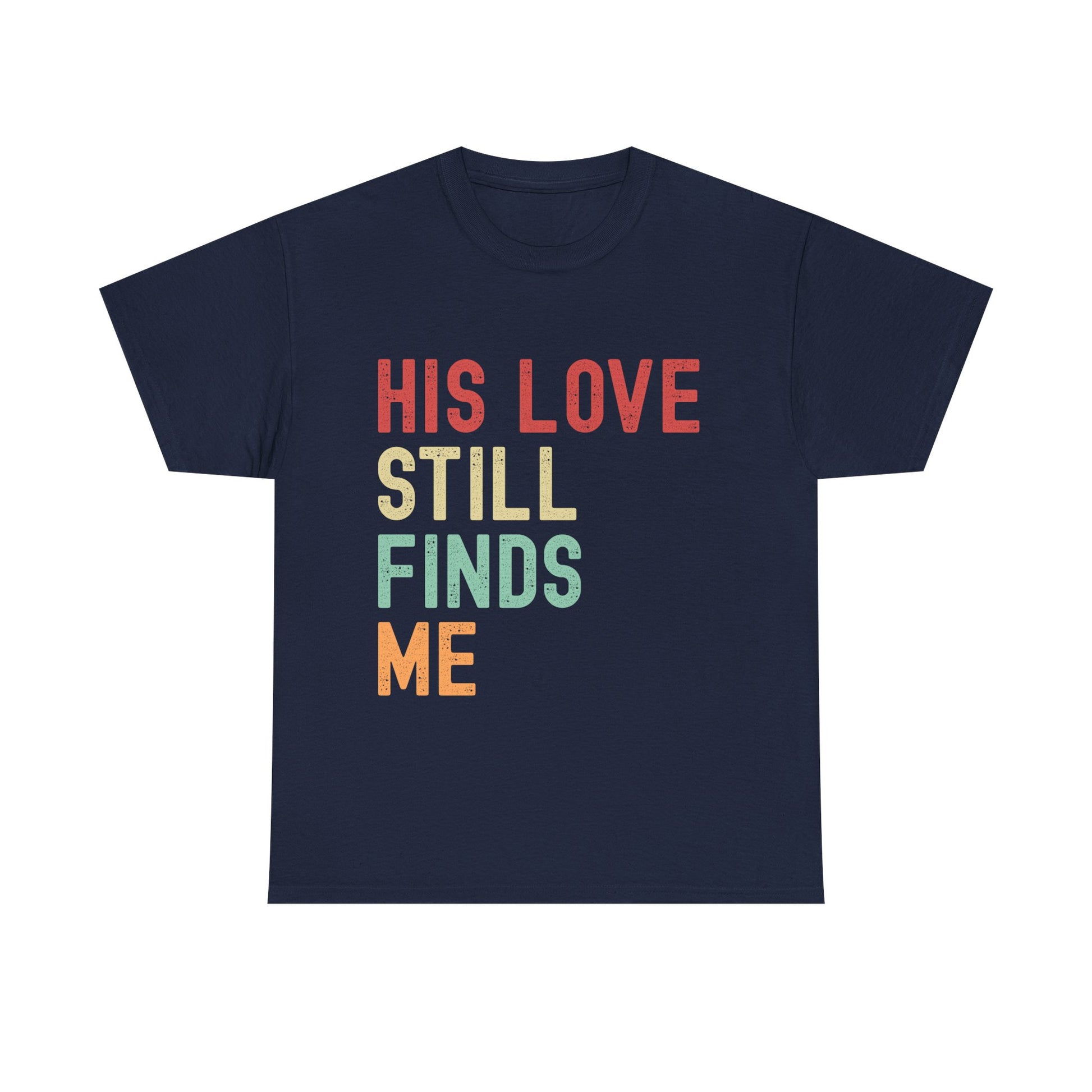 Navy blue t-shirt with colorful text 'HIS LOVE STILL FINDS ME' on a white background
