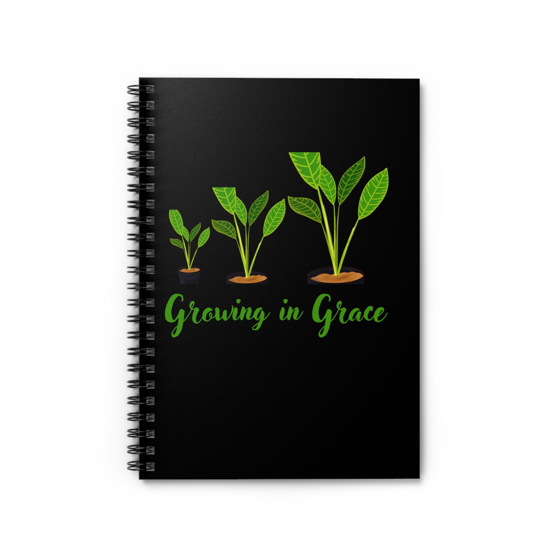Black notebook with green leaf illustrations and 'Growing in Grace' text on a white background
