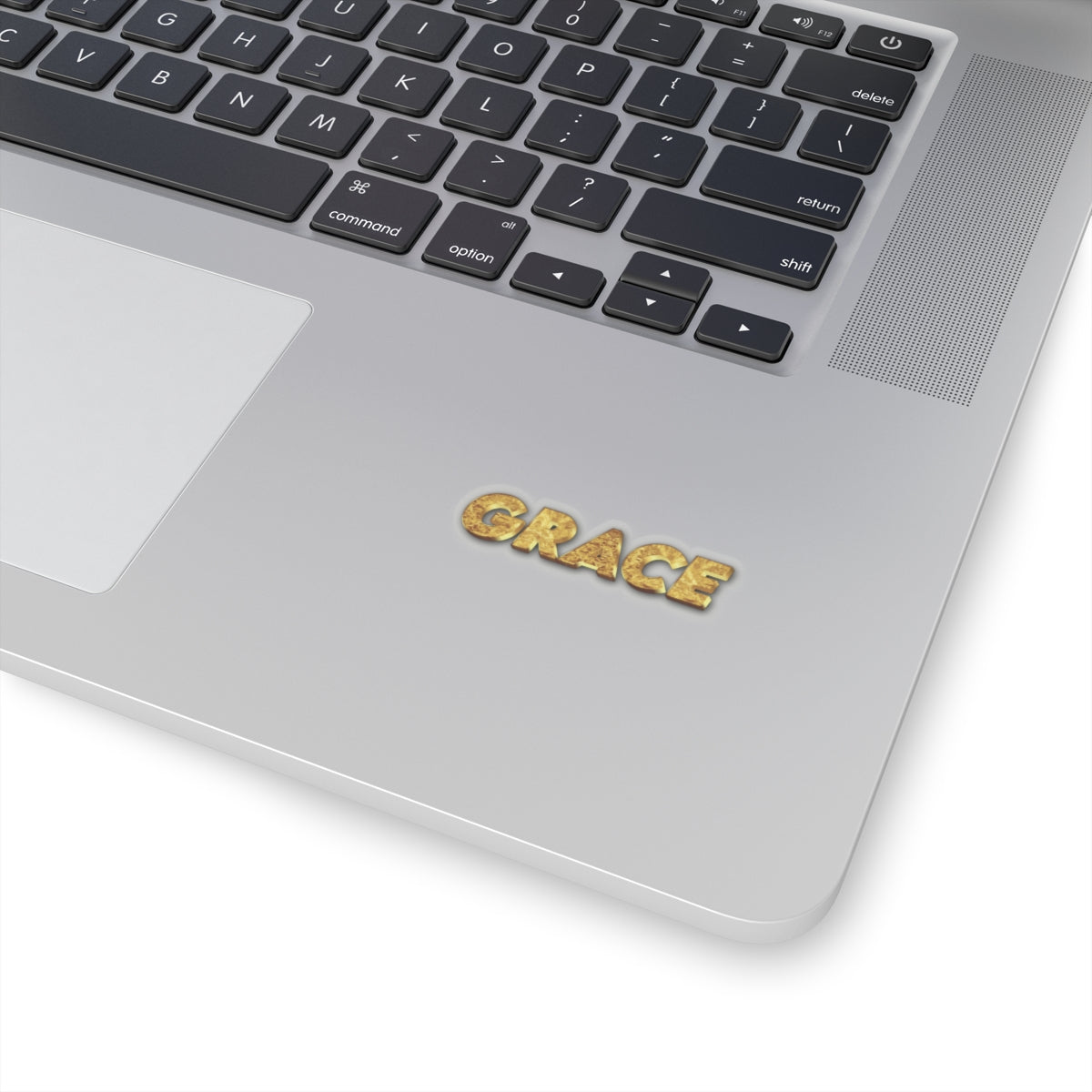 Laptop with 'GRACE' keycap on a white background